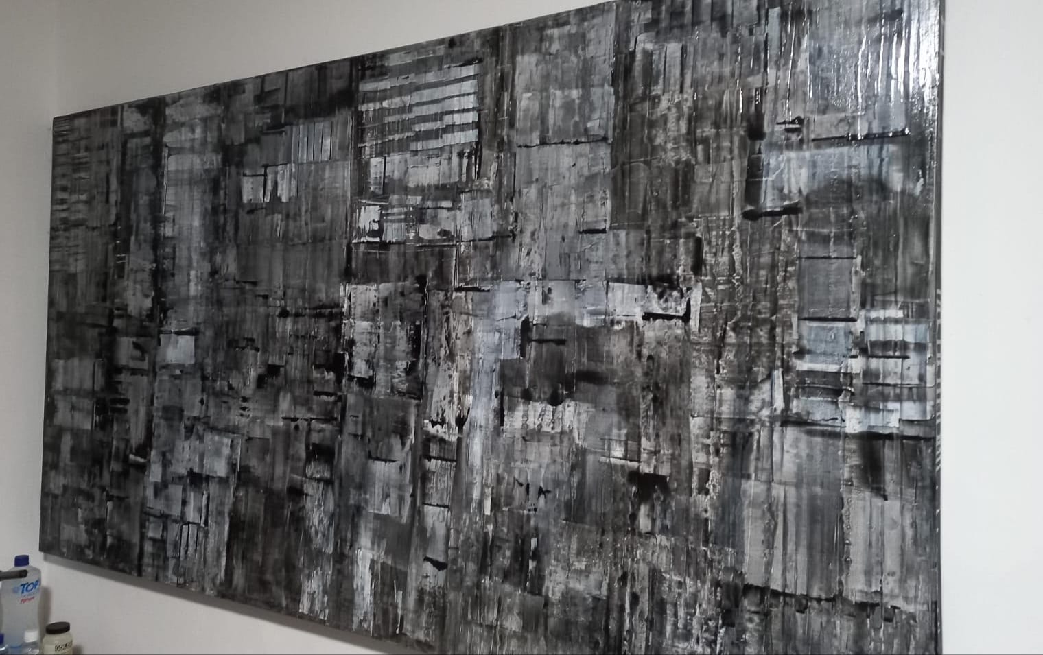 Relevos Nº 02 — palette-knife layers in black, white and grey under raking light